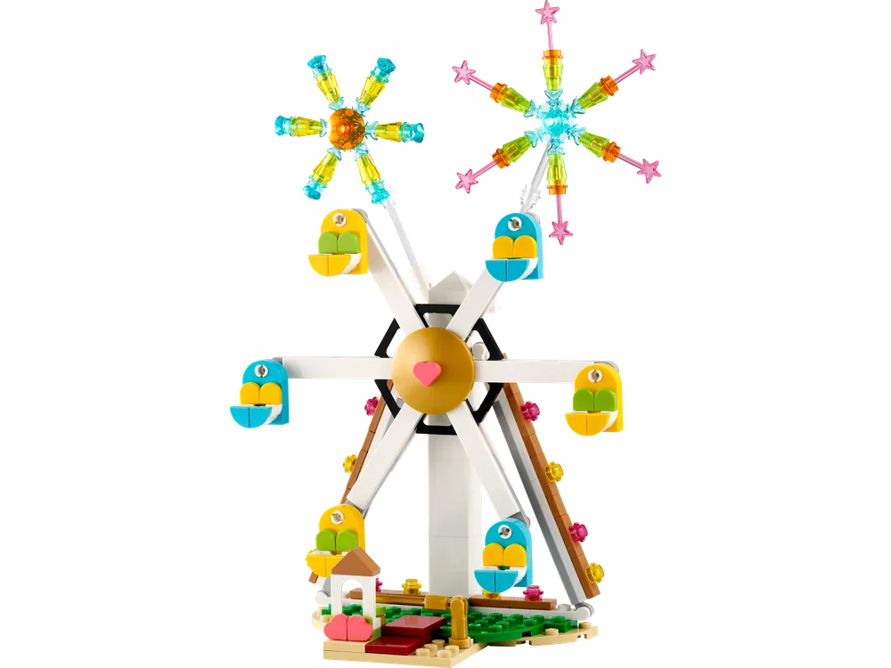 A LEGO Creator Ferris Wheel set 40758, a white frame supports six colorful yellow and blue gondolas, with two spinning firework displays made of transparent yellow, teal, and pink star pieces.