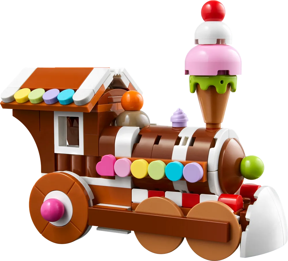 A LEGO Creator Celebration Series Gingerbread Train Ornament with a gingerbread house-style cabin, candy-button details, and an ice cream scoop chimney.