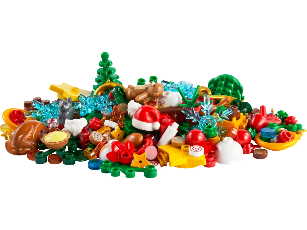 A close-up, top-down view of the LEGO Christmas Fun VIP Add-On Pack, showcasing a colorful pile of 146 assorted holiday-themed bricks and elements.