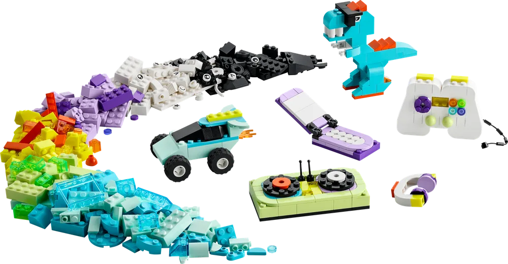 A wide variety of colorful LEGO bricks are spread out, forming a rainbow arc, with several completed models like a turquoise dinosaur, a car, a flip phone, and a game controller visible.