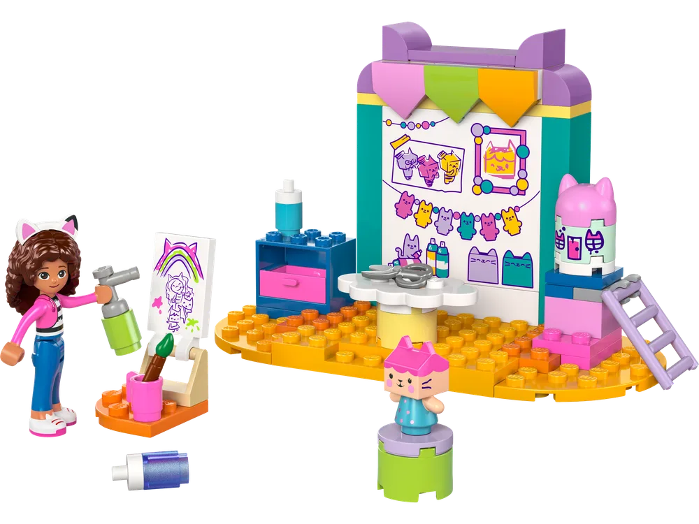 LEGO Gabby's Dollhouse Crafting with Baby Box set 10795 with Gabby minifigure and Baby Box figure at a vibrant art station.
