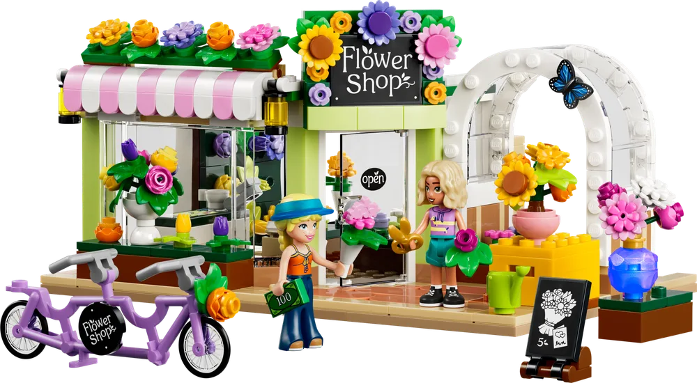A LEGO Friends Creative Flower Shop set 42693 with two minifigures, Nova and Astrid, and a lavender bicycle.