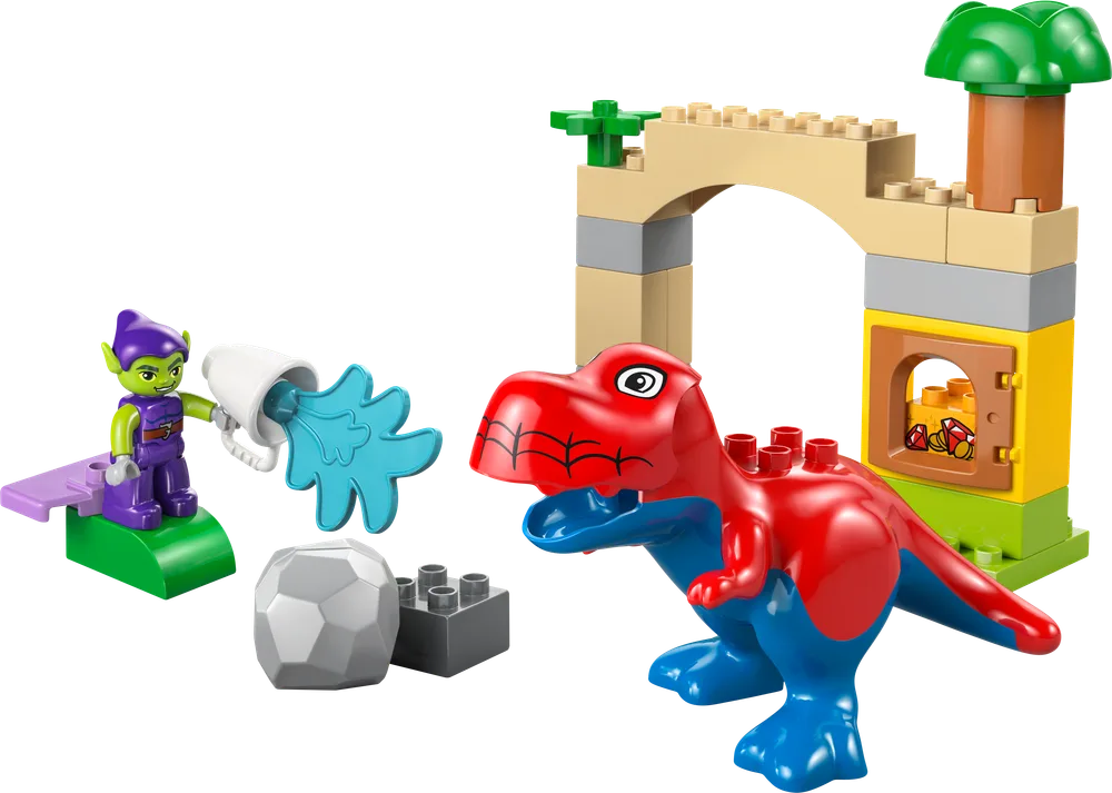 Green Goblin minifigure aiming a water cannon at a red and blue Spidey-Rex dinosaur, with a tan archway and a grey boulder.