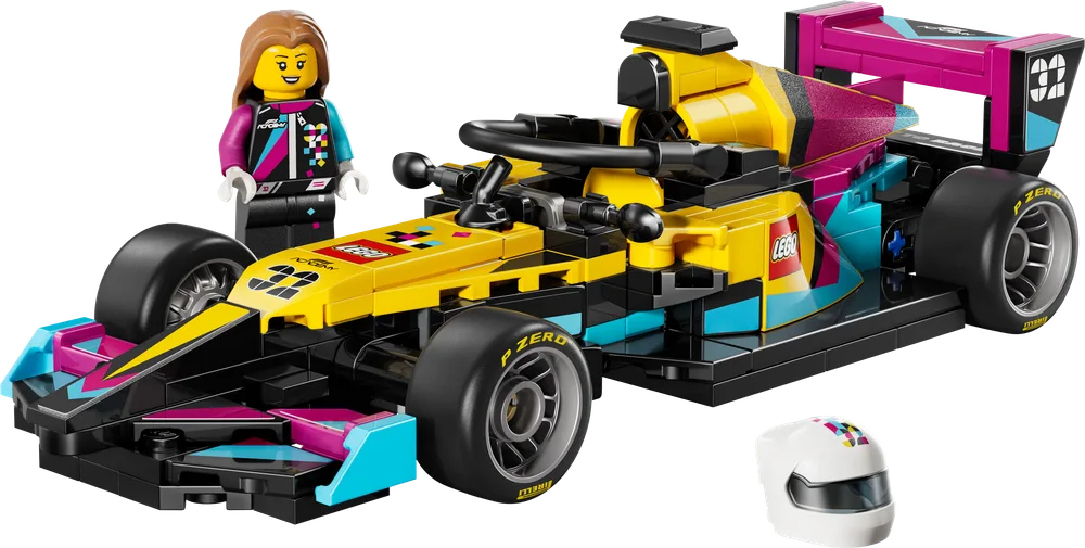 An F1 ACADEMY™ LEGO® race car and minifigure with helmet on a white background.