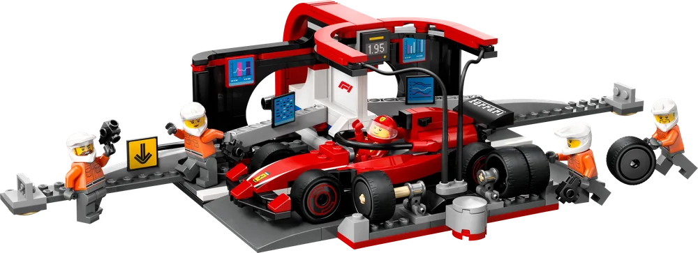 An F1 race car in a red and black pit stop garage with five minifigures, two holding tire changing tools and one holding a tire.