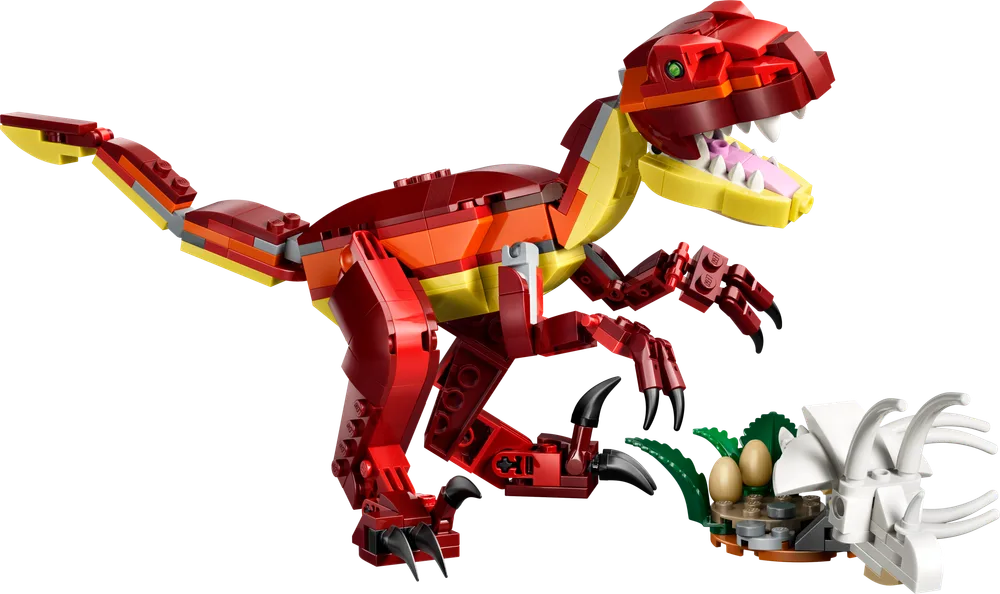 A fierce red and orange dinosaur with sharp claws and teeth lunges towards a small pile of white bone pieces and green plants.