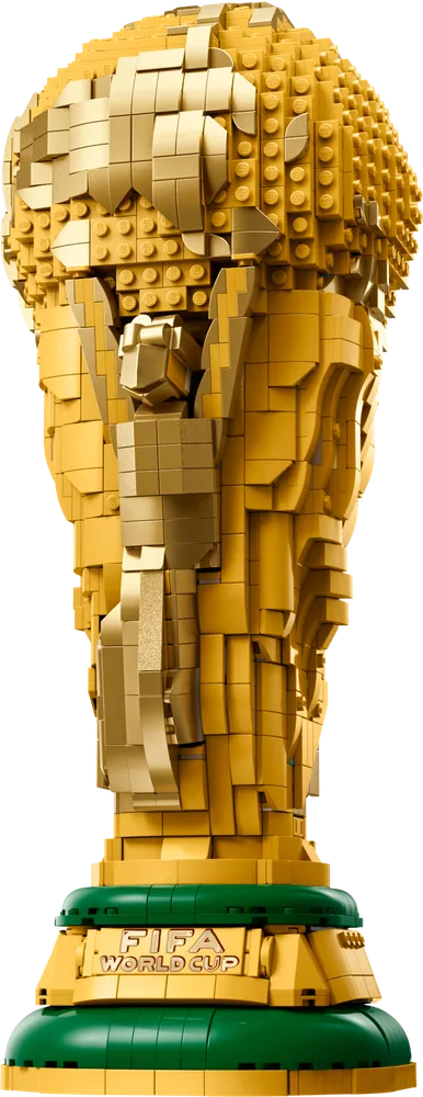 Close-up of the front of the LEGO FIFA World Cup trophy model, showcasing its intricate gold details and green base.