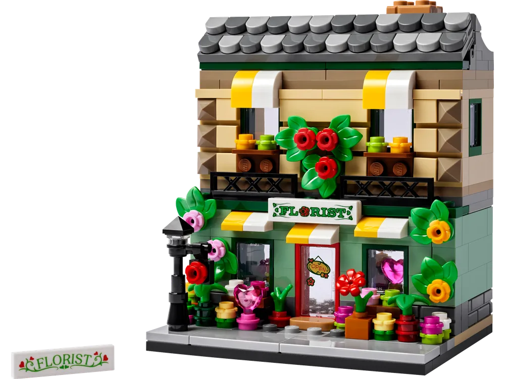 Front view of the LEGO Flower Store model, showcasing its vibrant exterior with a 'FLORIST' sign and numerous plant elements.