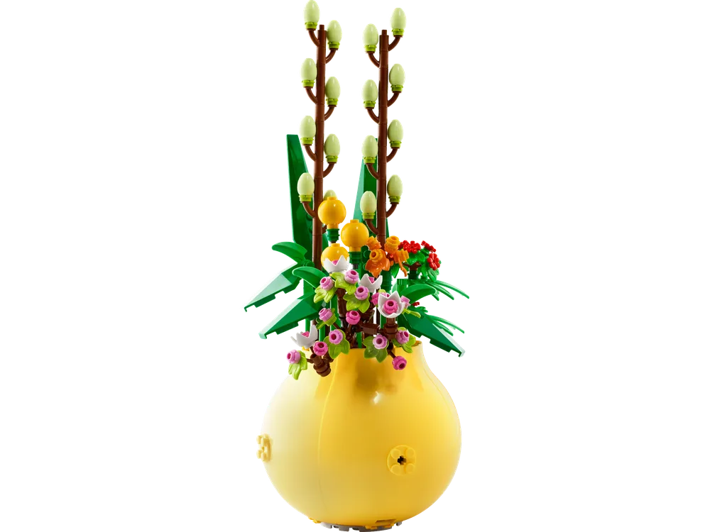 A LEGO Flowerpot set 40588, featuring vibrant brick-built flowers and pussy willow buds in a yellow rounded pot, isolated on a white background.