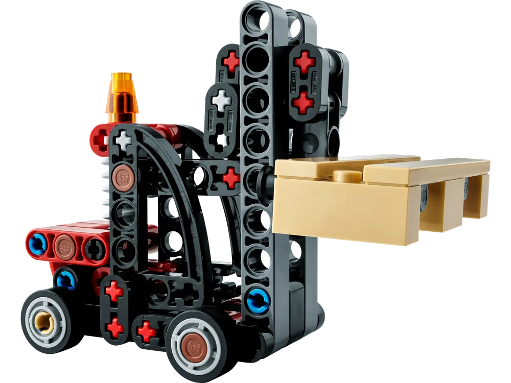 A close-up view of the LEGO Technic 30655 Forklift, built from black Technic elements with red and blue pins, an amber warning light, and a tan pallet on its forks, set against a white background.