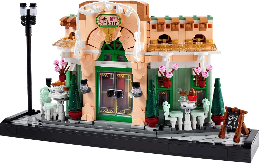 Front view of the LEGO Icons French Café set, showcasing its detailed exterior, outdoor seating, and street lamp.