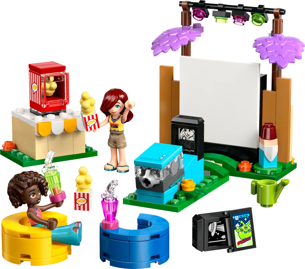 A LEGO Friends set featuring a movie screen, projector, popcorn stand, and two minifigures, Aliya and Paisley, enjoying an outdoor cinema setup.
