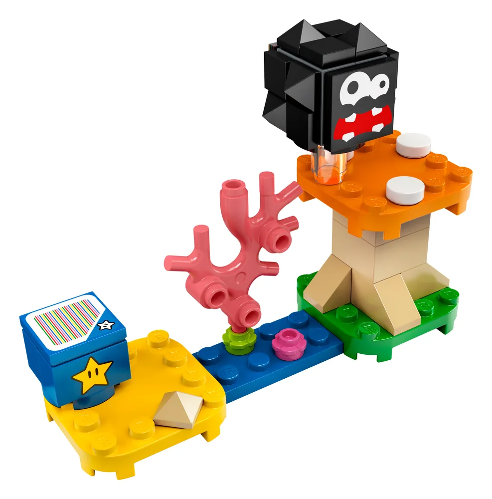 A LEGO Super Mario expansion set featuring a Fuzzy enemy on a mushroom platform, a pink coral obstacle, and a blue star block on yellow and blue terrain.