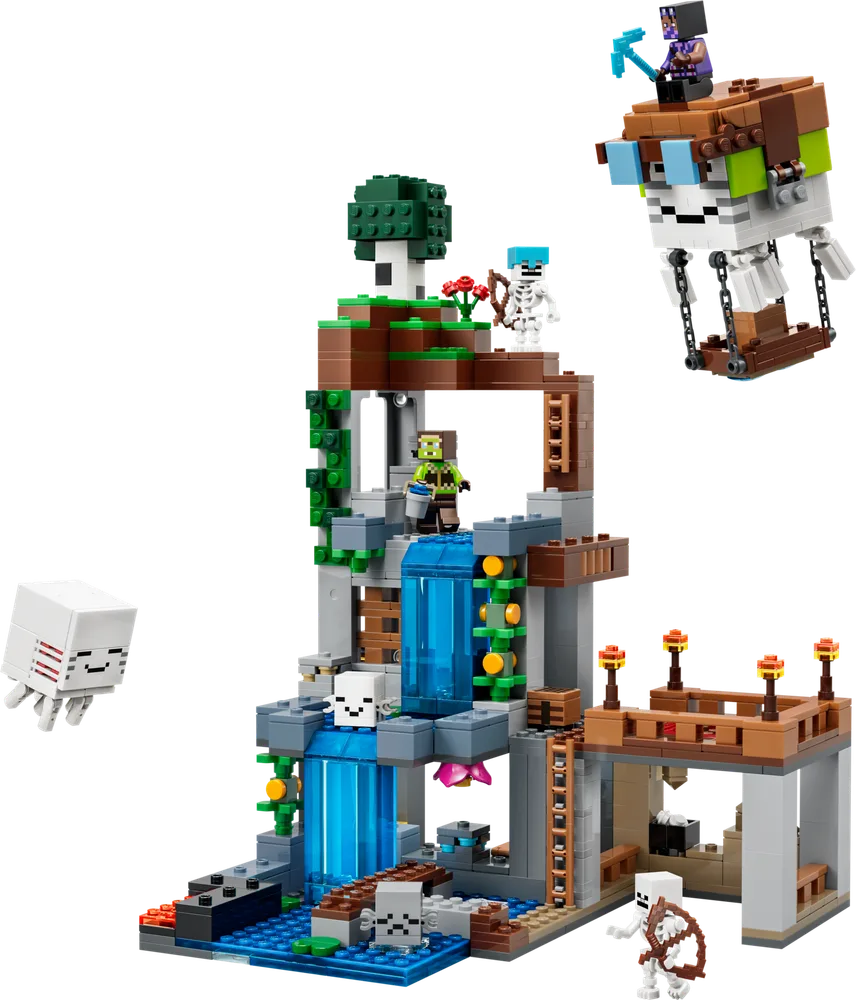 The completed LEGO Minecraft Ghast Station, featuring a multi-level structure with a prominent trans-blue waterfall, various minifigure characters, and two brick-built Ghast figures floating around the scene. The structure has brown, grey, and green elements, mimicking a natural, overgrown environment with a wooden platform on the right.