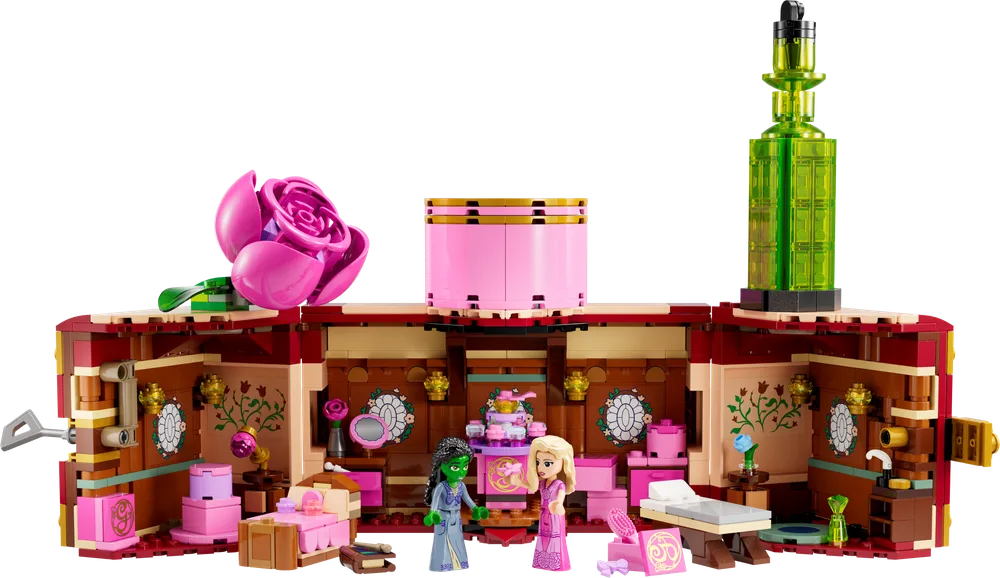 An open LEGO Wicked Glinda and Elphaba's Dormitory set, revealing two minifigures, Glinda and Elphaba, inside a richly decorated room.
