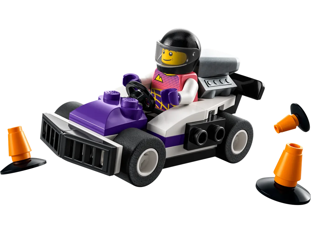 A LEGO Go-Kart Racer set 30589 with a minifigure in a purple and white go-kart, flanked by two orange traffic cones.