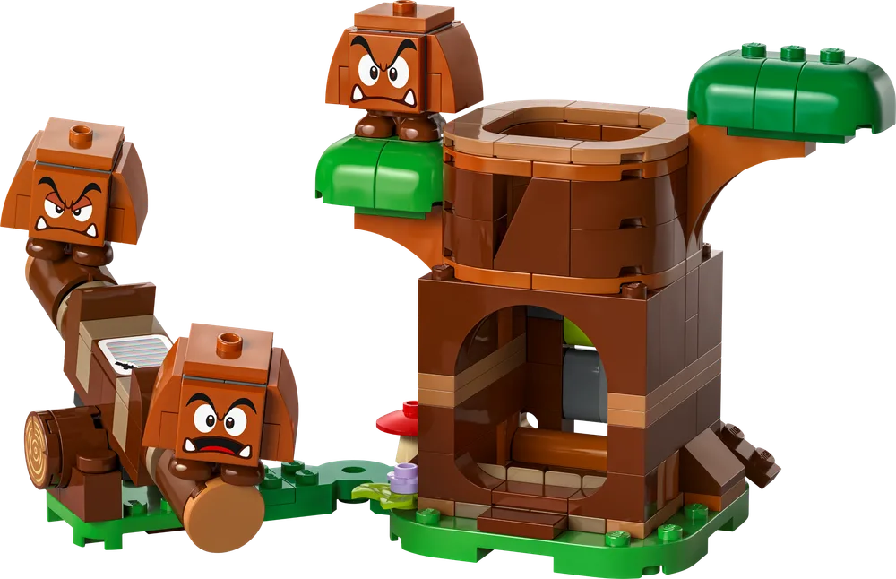 A LEGO Super Mario set, featuring a brown tree structure with green foliage and three Goombas. One Goomba is on top of the tree, another is a long segmented chain, and a third single Goomba stands nearby.