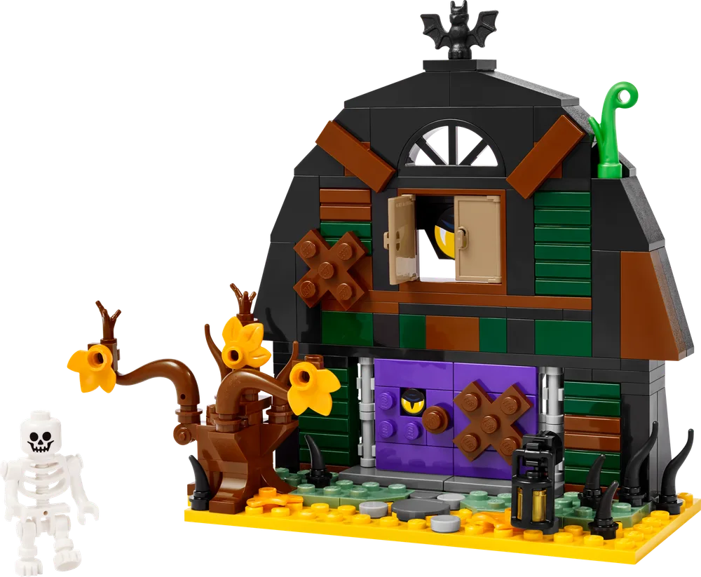 A LEGO Halloween barn set with a skeleton minifigure and a spooky tree on a yellow base plate.