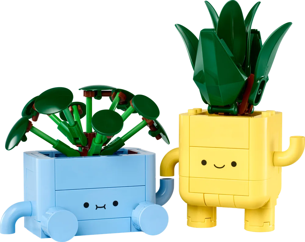 The LEGO Happy Plants set featuring a blue pot with round-leafed plant and a yellow pot with spiky-leafed plant, both with cute faces and limbs, isolated on white.