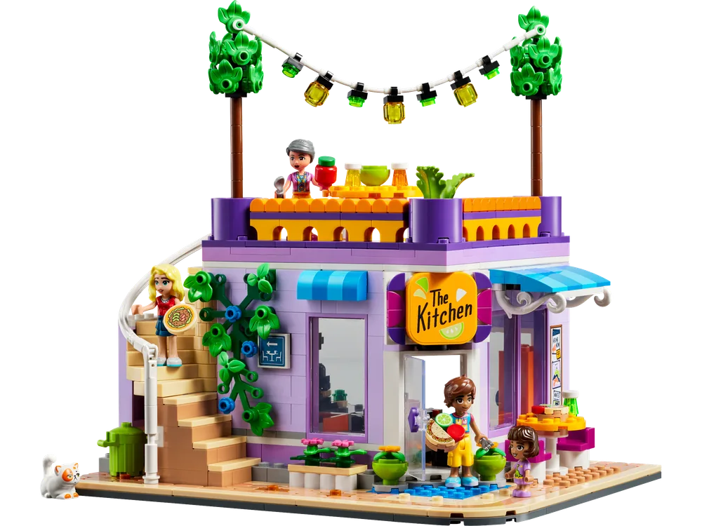 Front view of the LEGO Friends Heartlake City Community Kitchen set with minifigures and a cat.