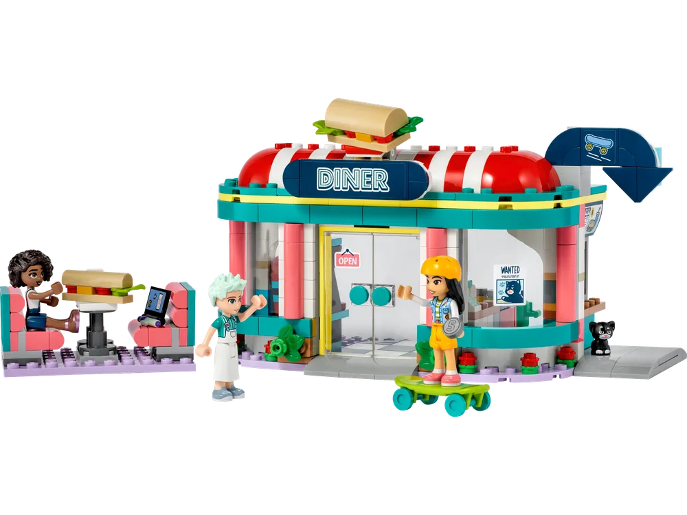 Full front view of LEGO Friends Heartlake Downtown Diner with three minifigures and a cat.