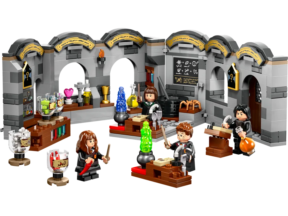 A LEGO Harry Potter Potions Class playset featuring a grey brick wall structure with arches, and four minifigures, each at a separate potion-making station with various colorful liquids and ingredients.