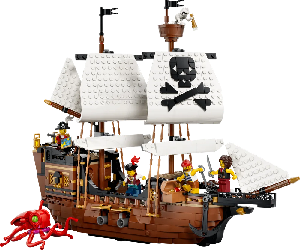 A detailed LEGO Creator Pirate Ship with white sails featuring a black skull and crossbones, populated by four minifigures and accompanied by a red octopus.