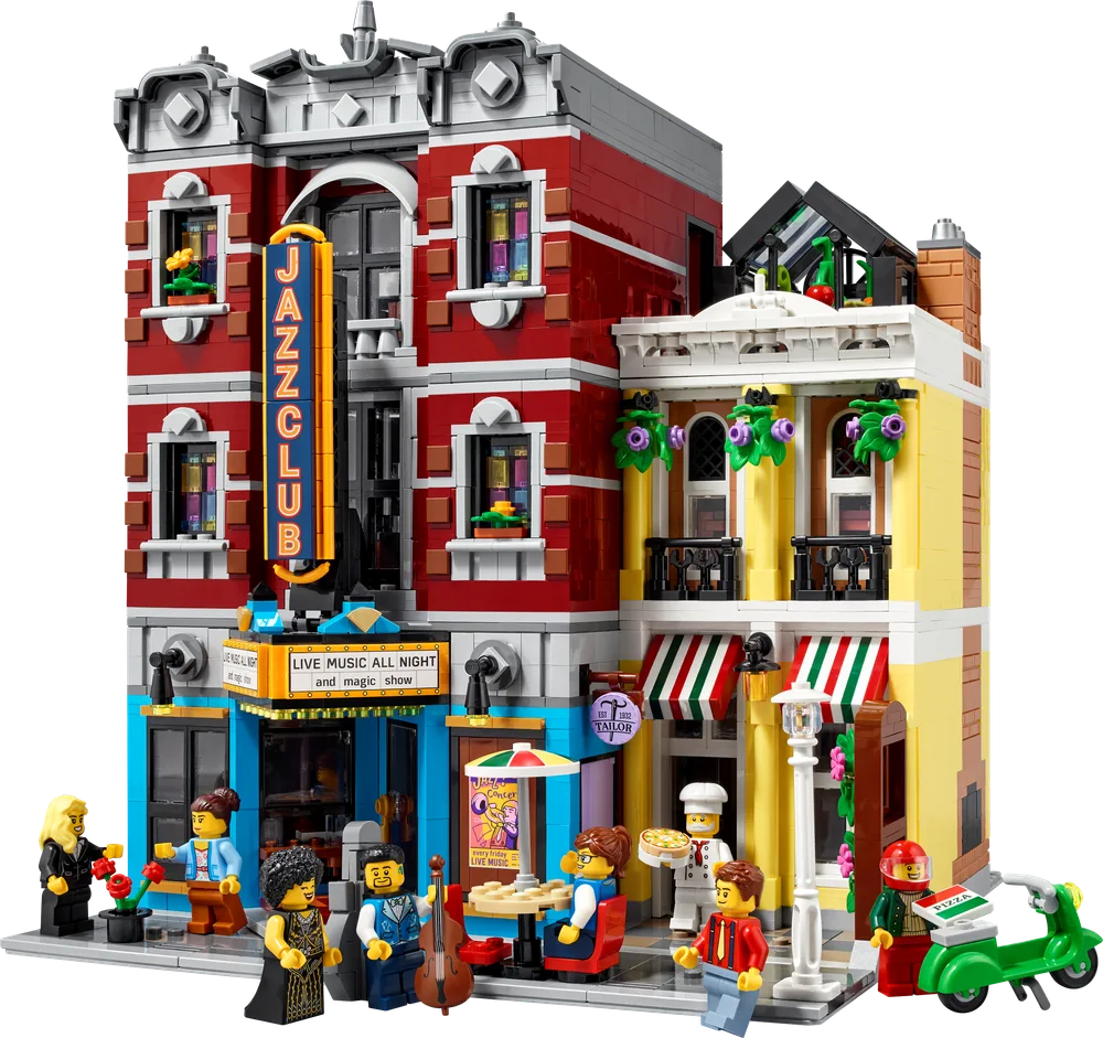 Front view of the LEGO Jazz Club, showcasing the red club building and the adjacent yellow pizzeria/tailor shop, with minifigures interacting on the sidewalk.