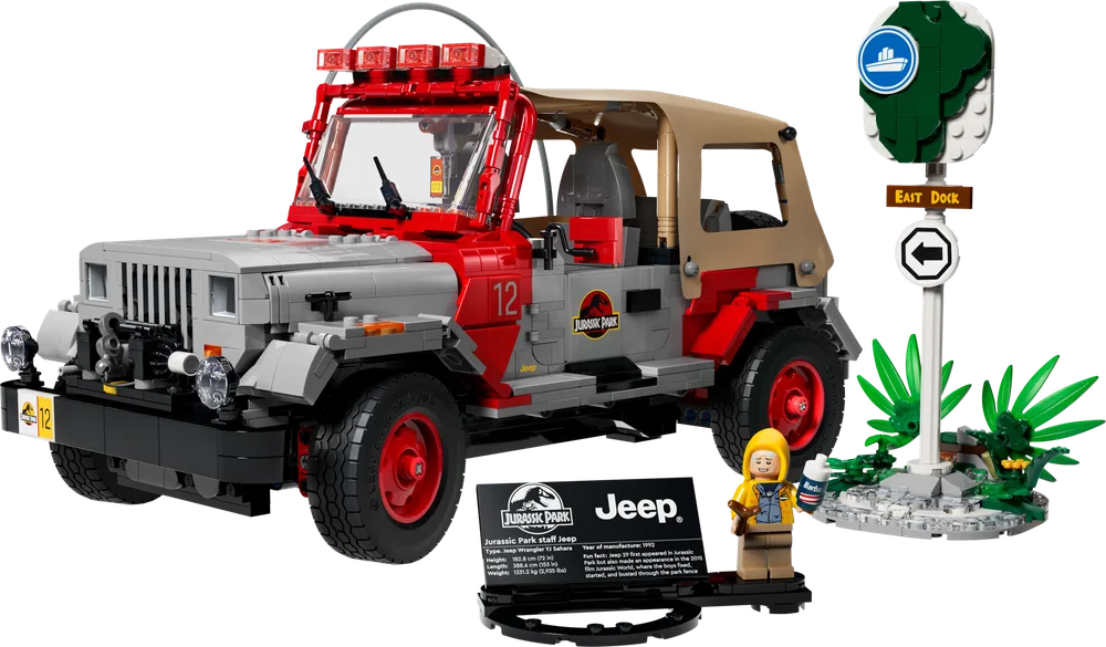 LEGO Jurassic Park Jeep Wrangler set 77984, featuring the red and gray vehicle, a 'Dennis Nedry' minifigure, a display plaque, and an 'East Dock' sign with foliage.