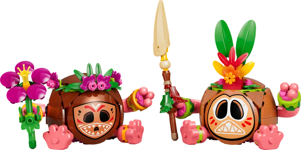 Two LEGO Kakamora figures, one with a pink flower crown, another with green and orange feathers and a spear.