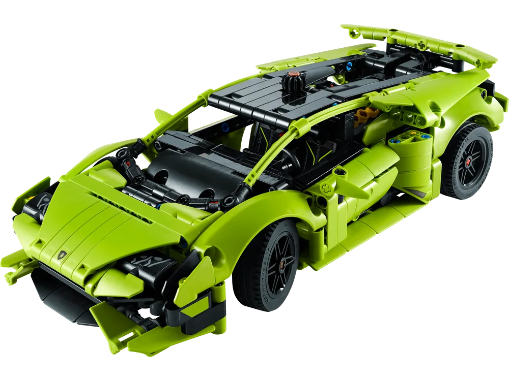 An angled top-down view of the assembled lime green LEGO Technic Lamborghini Huracán Tecnica, showcasing its aerodynamic design and exposed Technic framework.