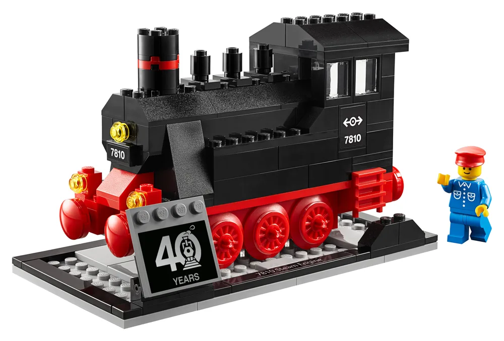 A black and red LEGO steam engine, model 7810, on a display base with a "40 YEARS" tile and a minifigure.