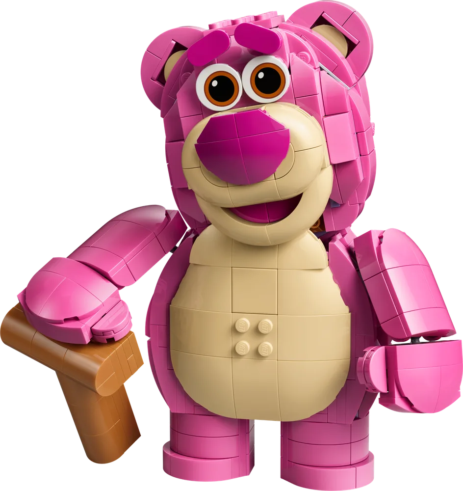 A large, pink Lego brick-built character, Lotso Huggin' Bear, holding a brown mallet, smiling wickedly.