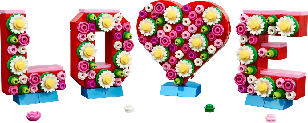 Detailed view of the LEGO Love Letters display, showcasing the 'L', 'O', heart, and 'E' characters, adorned with colorful flowers.