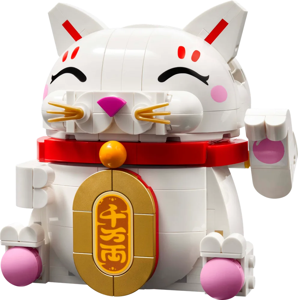 Front view of the LEGO Lucky Cat, a white brick-built cat with a red collar, golden coin, and pink details, raising its left paw.