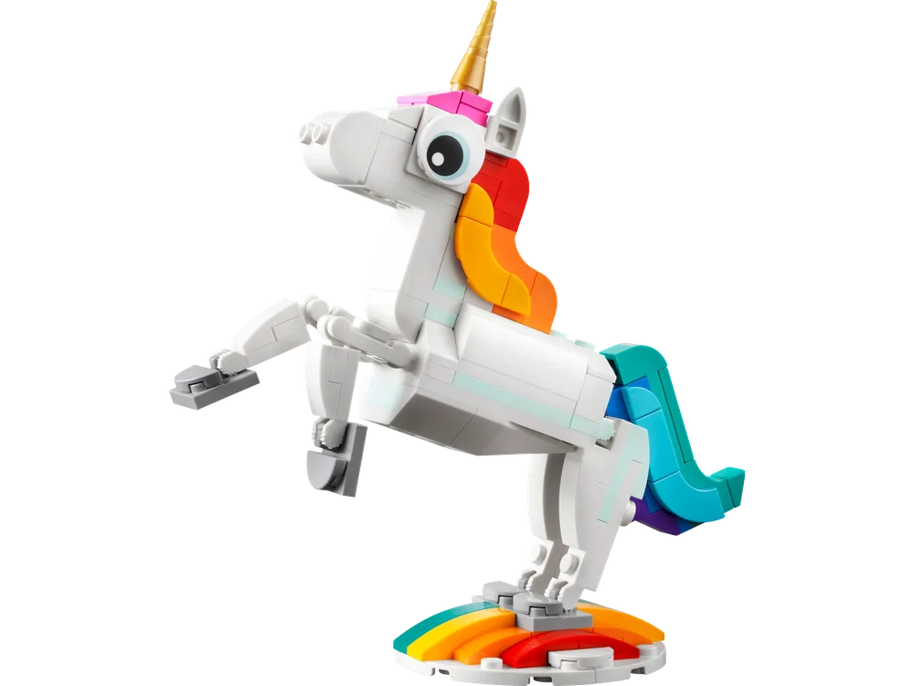 A white LEGO unicorn with a rainbow mane and tail rears up on a rainbow base.