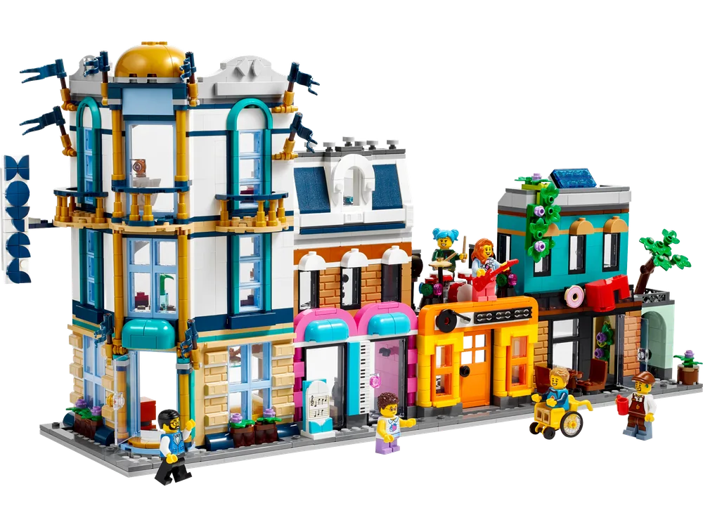 LEGO Creator 31141 Main Street in its primary configuration, showing three connected buildings with various shop fronts and a dome-topped corner building, populated by minifigures.