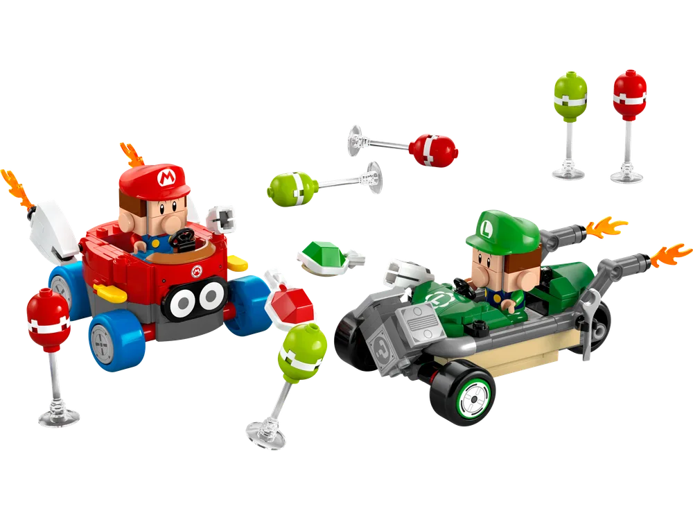 Baby Mario in a red kart and Baby Luigi on a green bike with several item box power-ups ready for a race.