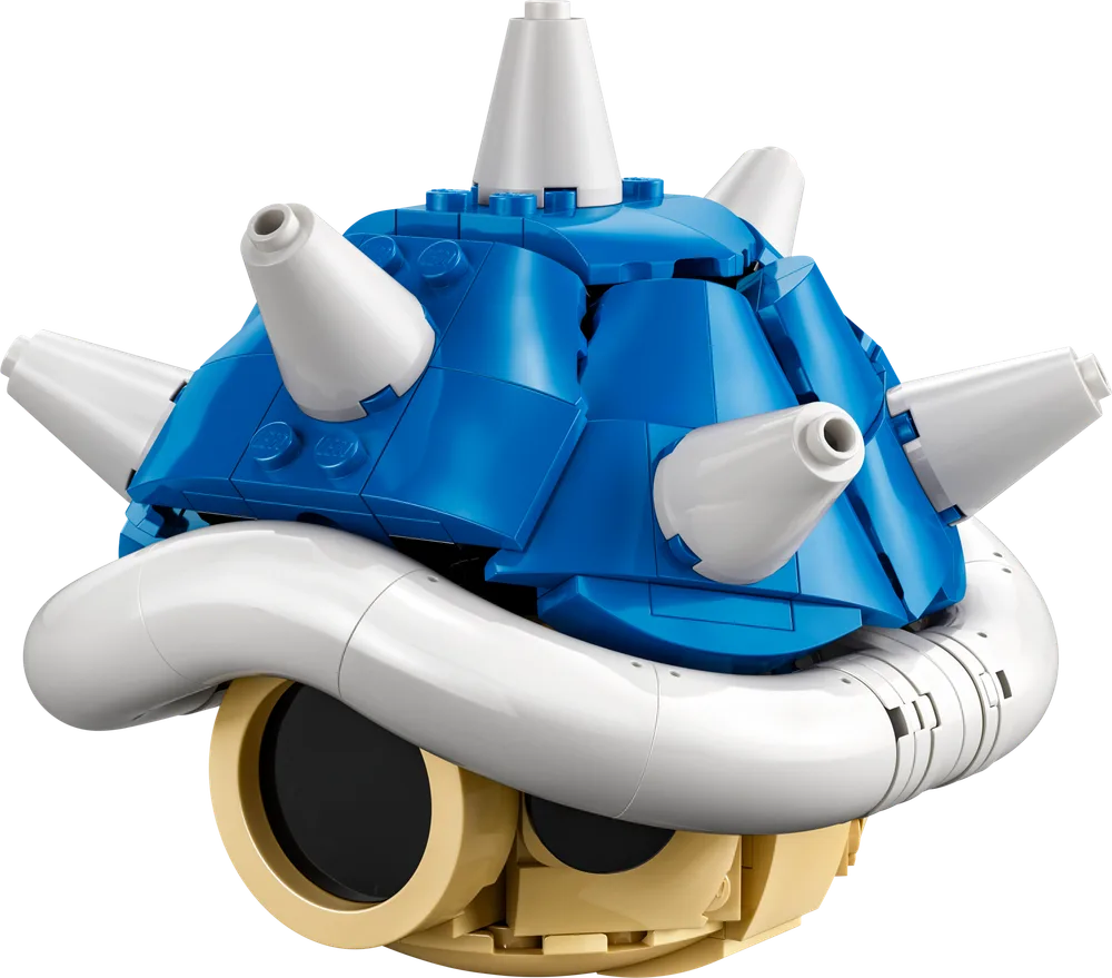A detailed close-up shot of the LEGO Mario Kart™ Spiny Shell model, featuring its vibrant blue top shell with white spikes and a tan base, showcasing the intricate build techniques.