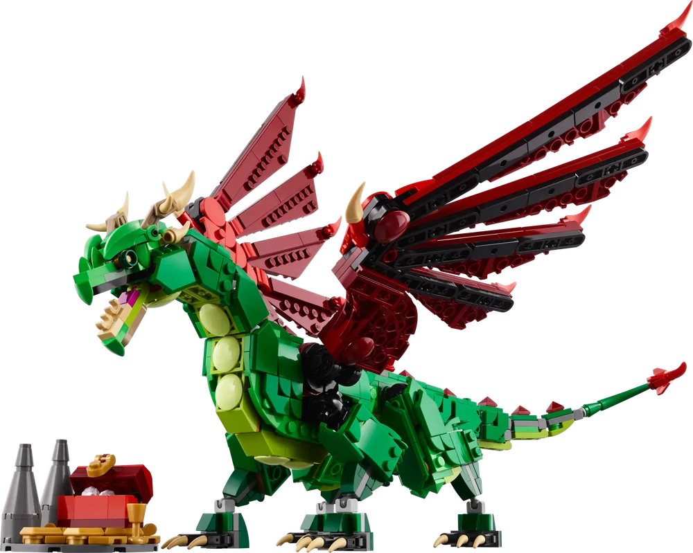 A large, green LEGO dragon with red wings, tan horns, and black claws stands posed next to a small gray and red treasure chest.