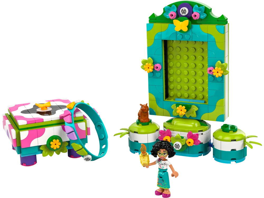 A bright green and teal photo frame and a matching jewelry box are displayed next to a Mirabel minifigure and a small capybara.
