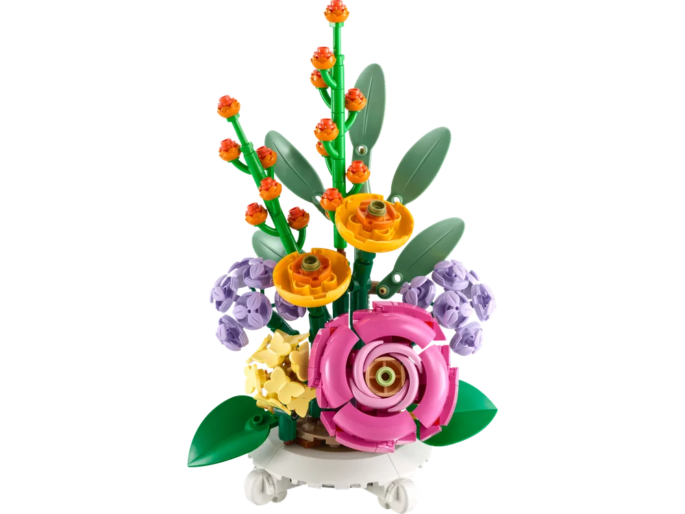 A close-up of a colorful LEGO Mixed Flowerpot set, showcasing various floral elements like a pink rose, yellow ranunculus, and lavender clusters in a white pot.