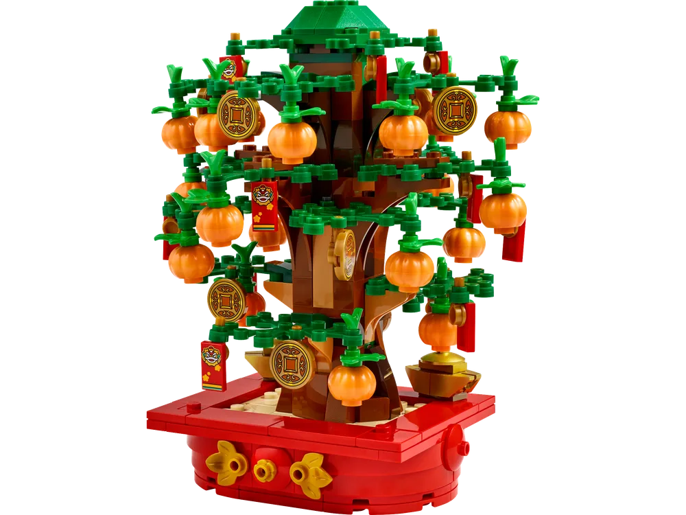 A fully assembled LEGO Money Tree with orange fruit, gold coins, and red envelopes, against a white background.