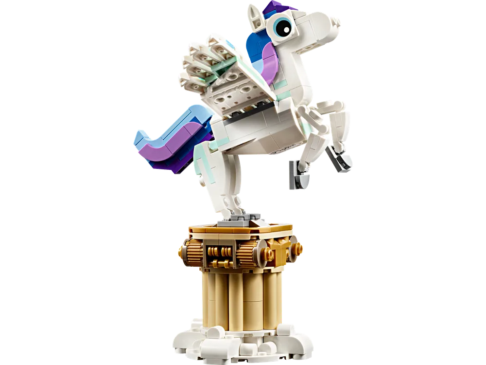 LEGO Creator Mythical Pegasus model, white with blue and purple accents, mid-leap on a gold and tan pedestal.