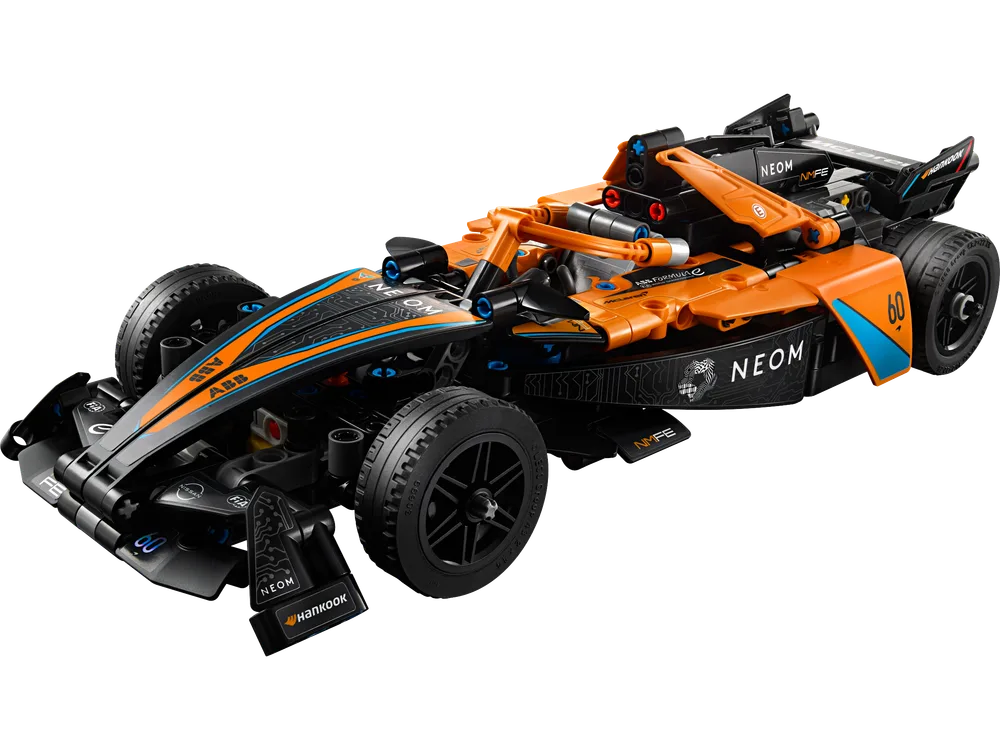 A close-up, dynamic angled shot of the LEGO Technic NEOM McLaren Formula E Race Car, showcasing its aerodynamic design and sponsor decals.