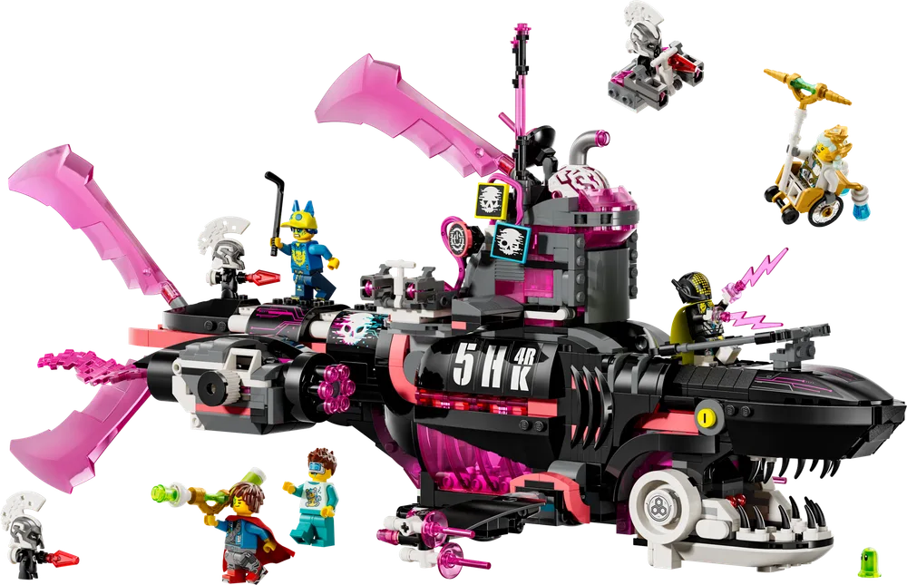 The LEGO DREAMZzz Nightmare Shark Submarine 71500, a black and pink shark-shaped vehicle with several minifigures surrounding it, including Mateo, Zoey, Nova, and Grimspawn.