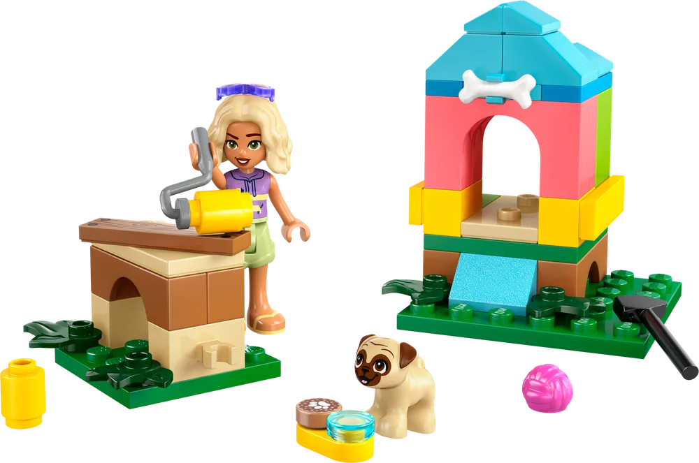 Nova paints a doghouse, next to a finished colorful doghouse, her pug, and accessories.