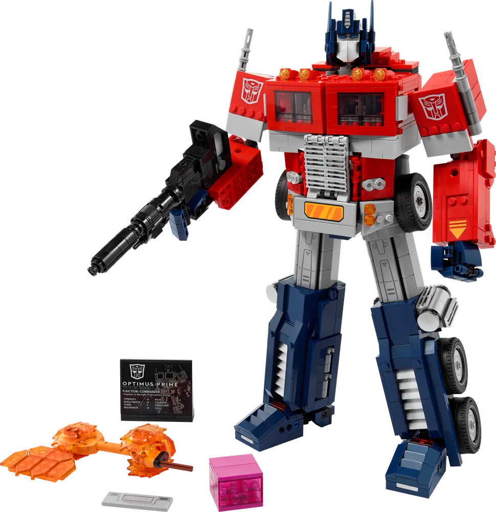 LEGO Optimus Prime 10302 in robot mode, standing tall with blaster, surrounded by Energon axe, Matrix of Leadership, and a data pad.