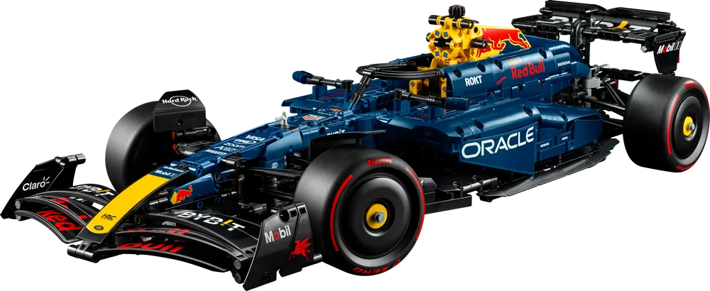 A dynamic shot of the LEGO Technic Oracle Red Bull Racing RB20 F1 Car, showcasing its sleek dark blue body and red accents from a front-quarter view.