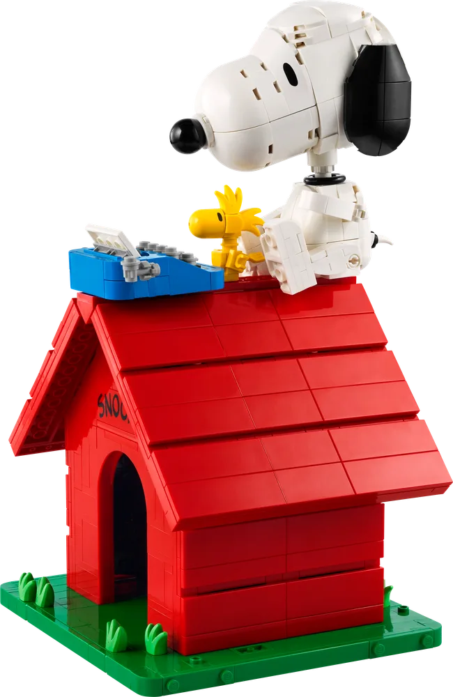 LEGO Ideas Peanuts Snoopy's Doghouse set with Snoopy, Woodstock, and typewriter on top.
